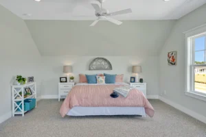 Modern pink and gray bedroom with cozy decor, natural light, and elegant minimalist design.