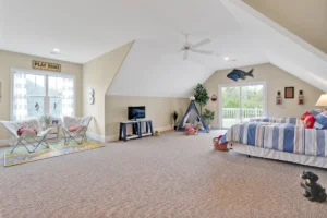 Bright attic bedroom and playroom with cozy décor, natural light, and family-friendly design.