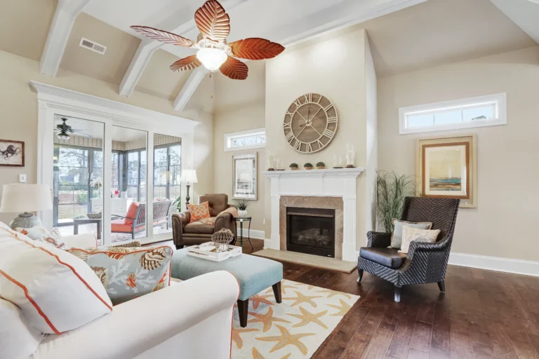 Airy coastal living room with vaulted ceilings, fireplace, natural textures, and seaside-inspired decor.